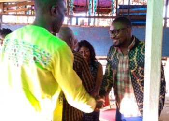 Representative of CAMASEJ National, Jato Richard shaking hands with New CAMASEJ NW president, Ndi Tsembom Elvis