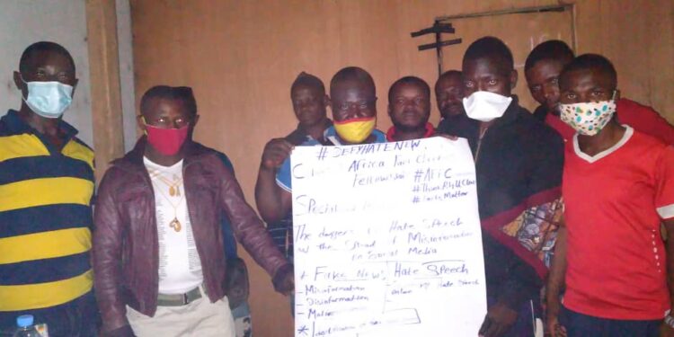 Participants in group photo with organiser