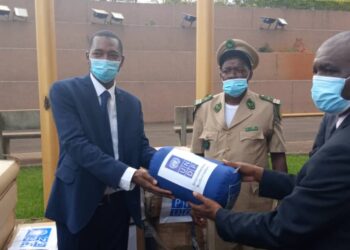 UNDP resident representative in Cameroon, Alasane Ba (L), handing over the biodiversity conservation equipments to the Government