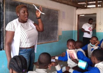 Vanessa Berinyu, Human Resource Manager at DHF schooling the students on the use of menstrual pads