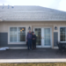 Doc and Sharon Skordahl stand in front of their new home in Riverview Estates (Photo Credit: poineer.org)