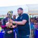 Edwin Eselem, promoter of the tournament handing over the trophy to the winning team