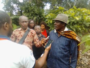 Bikele Ambomo Bruno, Chief of Olembe-Batchenga, talking to our reporters inside his cocoa farm
