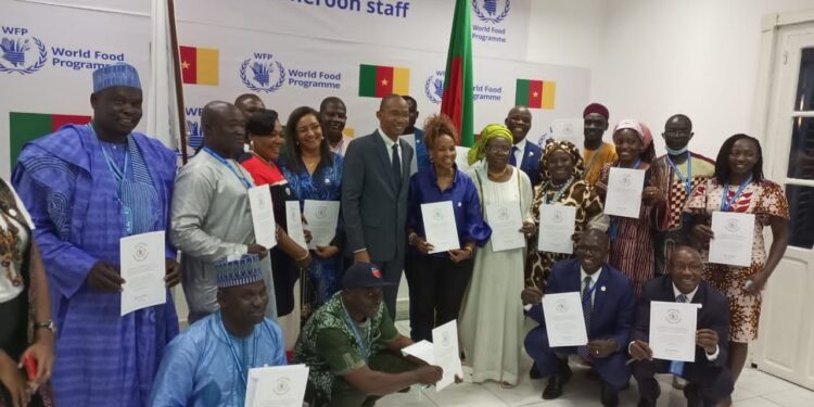 WFP staff in Cameroon celebrating the Nobel Peace Prize Award in Yaounde with their regional director for West and Central Africa
