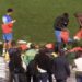 Players changing on the turf after refusing to use the dressing room in Algeria