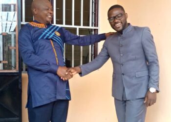 New MEJU President, Charm Victor Bama (R), being congratulated by former president, Jam Charles (L)