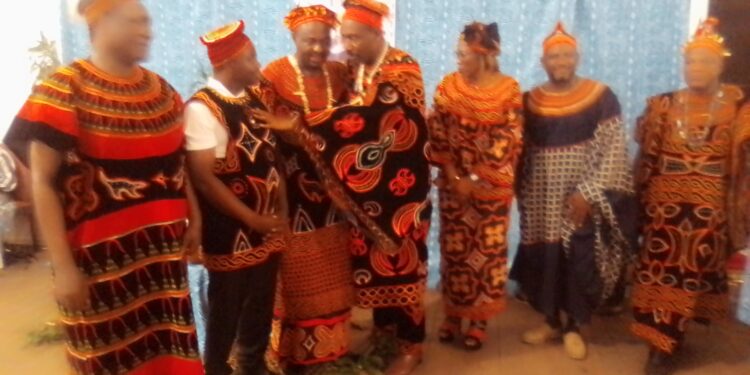 Hon. Agho Oliver talking to the Fon of Kedjom Ketinguh at group photo session