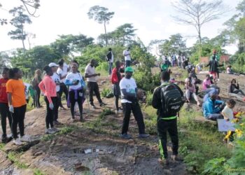 Hikers at the top of mount Mvog Betsi, collecting waste plastics