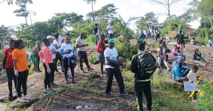 Hikers at the top of mount Mvog Betsi, collecting waste plastics