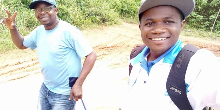 Mr Kimbi(L) and colleague of UFC on humanitarian work