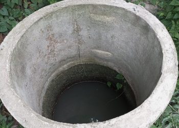 Some women in Ogun State dig out holes for water storage to irrigate their farms. Photo/Adetutu Sebolowe/ AWiM