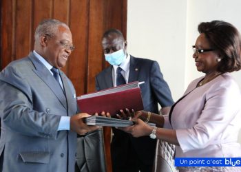 Minister Joseph Le of Public Service and Administrative Reform and CAMTEL's GM, Judith Yah Sunday Epse Achidi exchanging the documents signed Monday June 13, 2022