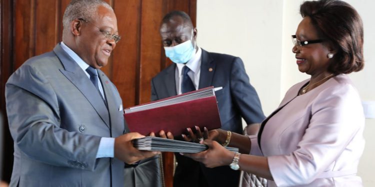 Minister Joseph Le of Public Service and Administrative Reform and CAMTEL's GM, Judith Yah Sunday Epse Achidi exchanging the documents signed Monday June 13, 2022
