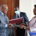 Minister Joseph Le of Public Service and Administrative Reform and CAMTEL's GM, Judith Yah Sunday Epse Achidi exchanging the documents signed Monday June 13, 2022