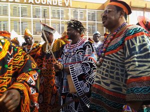 HRH Fon Forchesiri III (middle) others dancing with traditional dance group during maiden visit in Yaoundé