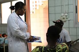 Volunteer Medical Personnel Cameroon dishing out cancer counsel to men in a hospital in Cameroon (Credit: VMPC)