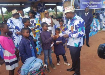 Hon. Agho Oliver handing out the packages to the beneficiaries