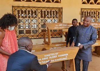 Hon. Agho Oliver Bamenju handing over the gifts symbolically to CCAST Bambili officials