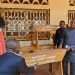 Hon. Agho Oliver Bamenju handing over the gifts symbolically to CCAST Bambili officials