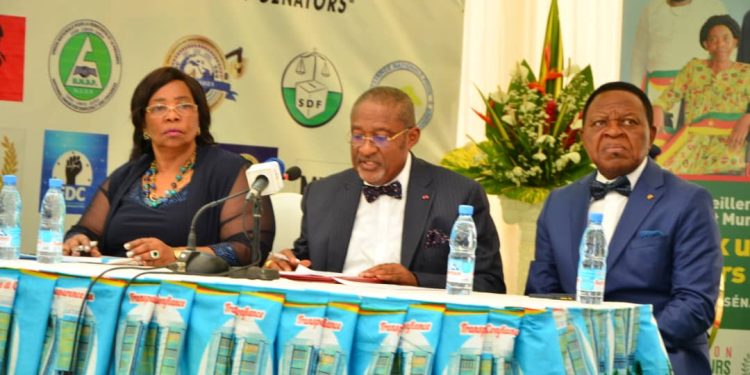 Board chairperson of Elecam, Enow Abrams Egbe (Middle) reading out the list of validated candidates