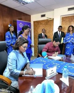 Judith Yah Sunday Epse Achidi and Samuel Eto'o Fils signing the partnership agreement in Yaounde 