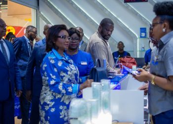 Camtel's General Manager, Judith Yah Sunday Epse Achidi listening to staff of Blue Store Warda in Yaounde