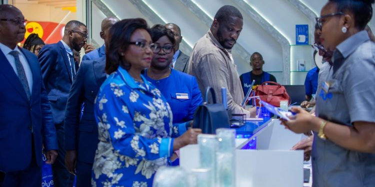 Camtel's General Manager, Judith Yah Sunday Epse Achidi listening to staff of Blue Store Warda in Yaounde