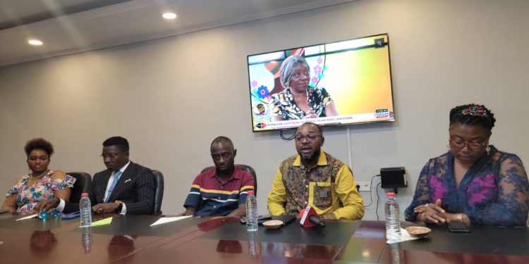 Officials at the press conference in Douala