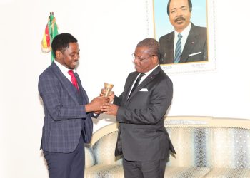 Prof Mbarika Victor (L) at the audience with PM (R)