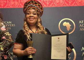 HOFNA Executive Director, Christelle Bay Nfor, presenting her international award in London