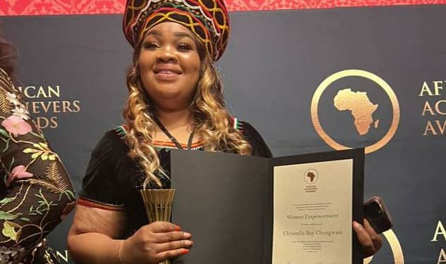 HOFNA Executive Director, Christelle Bay Nfor, presenting her international award in London