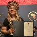 HOFNA Executive Director, Christelle Bay Nfor, presenting her international award in London