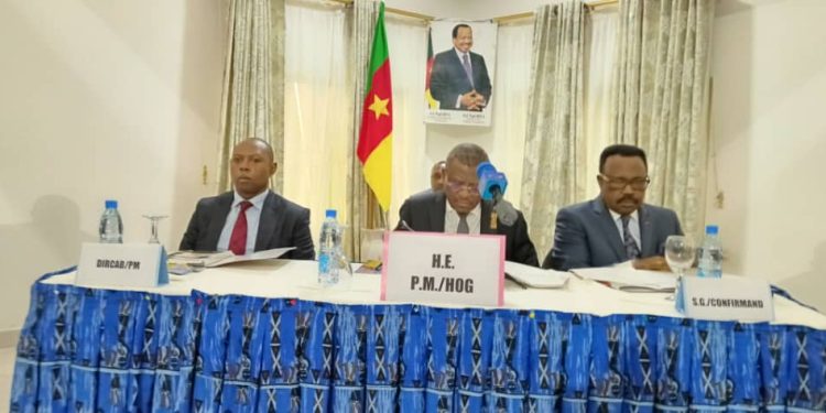 Prime Minister (center) and other committee members at the session in Buea