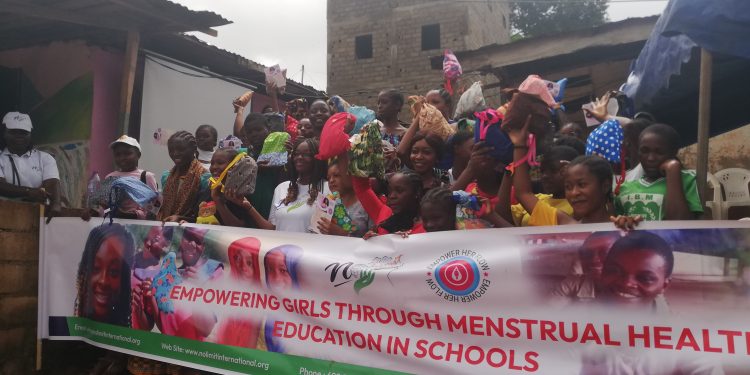 Group picture with officials of the NGO, Yde II Council and the young girls from Cite Verte