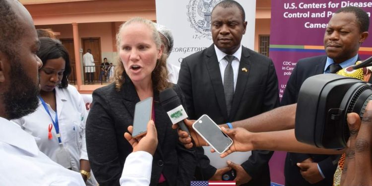 Colleen Oakes, PEPFAR Country Coordinator talking to the press