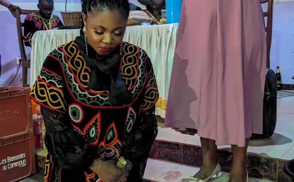 Delly Singah receiving blessings from home community in Yaounde