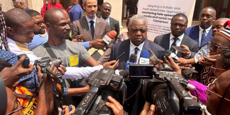 Communication minister, Rene Emmanuel Sadi, speaking to the press at the workshop in Yaounde
