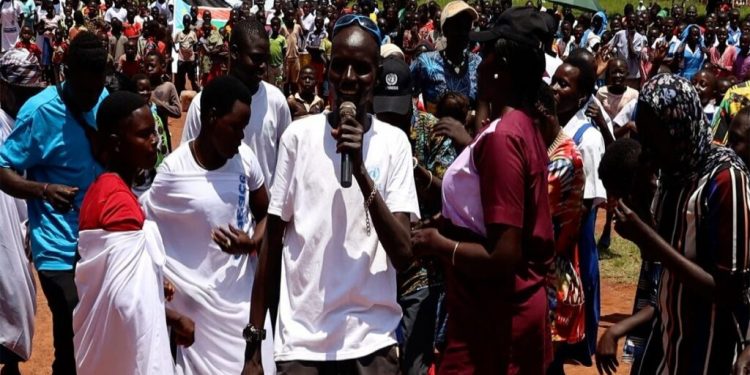 Tambura residents walk and dance their way to Peace Day celebrations