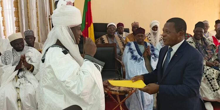 Lamido of Garoua, Ibrahim El Rachidine handing motion to Minister Paul Atanga Nji
