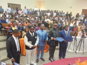 Officials with artists at the event